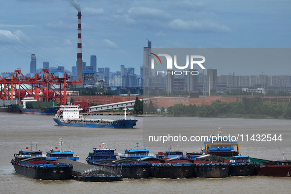 Cargo ships are anchoring in the waters of the Nanjing section of the Yangtze River in Nanjing, Jiangsu province, China, on July 25, 2024. O...