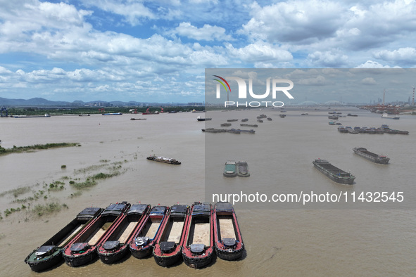 Cargo ships are anchoring in the waters of the Nanjing section of the Yangtze River in Nanjing, Jiangsu province, China, on July 25, 2024. O...