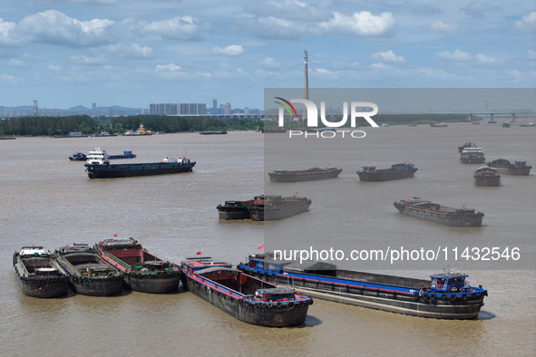 Cargo ships are anchoring in the waters of the Nanjing section of the Yangtze River in Nanjing, Jiangsu province, China, on July 25, 2024. O...