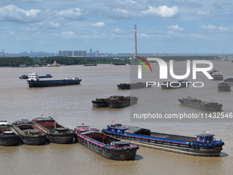 Cargo ships are anchoring in the waters of the Nanjing section of the Yangtze River in Nanjing, Jiangsu province, China, on July 25, 2024. O...