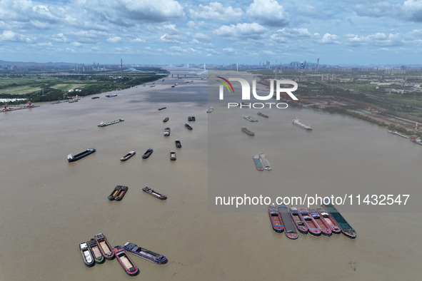 Cargo ships are anchoring in the waters of the Nanjing section of the Yangtze River in Nanjing, Jiangsu province, China, on July 25, 2024. O...