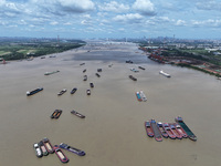 Cargo ships are anchoring in the waters of the Nanjing section of the Yangtze River in Nanjing, Jiangsu province, China, on July 25, 2024. O...