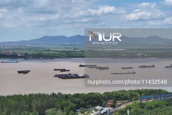 Cargo ships are anchoring in the waters of the Nanjing section of the Yangtze River in Nanjing, Jiangsu province, China, on July 25, 2024. O...