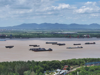 Cargo ships are anchoring in the waters of the Nanjing section of the Yangtze River in Nanjing, Jiangsu province, China, on July 25, 2024. O...