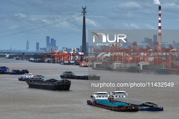 Cargo ships are anchoring in the waters of the Nanjing section of the Yangtze River in Nanjing, Jiangsu province, China, on July 25, 2024. O...