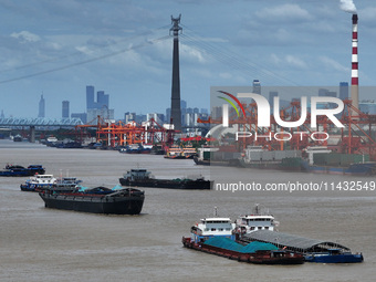 Cargo ships are anchoring in the waters of the Nanjing section of the Yangtze River in Nanjing, Jiangsu province, China, on July 25, 2024. O...