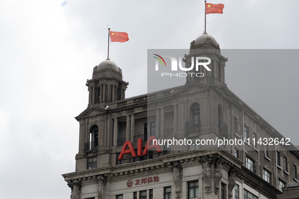 The AIA Building on the Bund in the Huangpu district of Shanghai, China, on July 25, 2024, is standing prominently. 