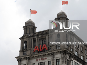 The AIA Building on the Bund in the Huangpu district of Shanghai, China, on July 25, 2024, is standing prominently. (