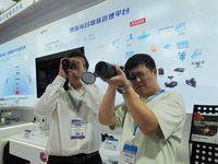 Visitors are experiencing the ''infrared Telescope'' at the ''Fifth World Photon Congress 2024'' in Beijing, China, on July 25, 2024. (