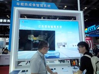 Visitors are visiting the ''Infrared Sensing Intelligent Driving System'' at the ''Fifth World Photonics Congress 2024'' in Beijing, China,...