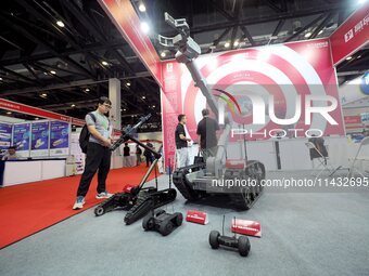 Visitors are visiting the ''Explosive disposal robot'' at the ''Fifth World Photonics Congress 2024'' in Beijing, China, on July 25, 2024. (