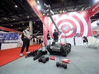 Visitors are visiting the ''Explosive disposal robot'' at the ''Fifth World Photonics Congress 2024'' in Beijing, China, on July 25, 2024. (