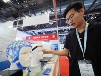 Visitors are visiting the ''7T Magnetically compatible EEG Acquisition System'' at the ''Fifth World Photonics Congress 2024'' in Beijing, C...