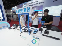 Visitors are visiting a ''fiber optic spectrometer'' at the ''Fifth World Photonic Congress 2024'' in Beijing, China, on July 25, 2024. (