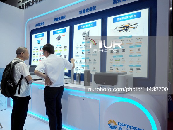 Visitors are visiting the ''Spectrometer'' at the ''Fifth World Photon Congress 2024'' in Beijing, China, on July 25, 2024. 