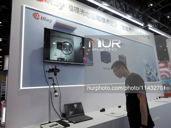 Visitors are visiting the ''HD shortwave Infrared Camera'' at the ''5th World Photonic Congress 2024'' in Beijing, China, on July 25, 2024. 