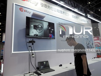 Visitors are visiting the ''HD shortwave Infrared Camera'' at the ''5th World Photonic Congress 2024'' in Beijing, China, on July 25, 2024....