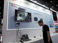 Visitors are visiting the ''HD shortwave Infrared Camera'' at the ''5th World Photonic Congress 2024'' in Beijing, China, on July 25, 2024....