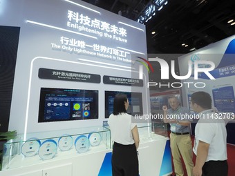 Visitors are visiting ''Special Optical fibers'' at the ''Fifth World Photonics Congress 2024'' in Beijing, China, on July 25, 2024. (