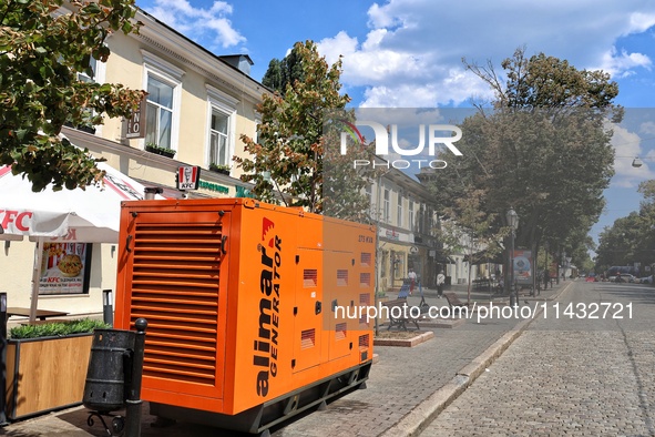 A diesel generator is being used as a backup during power outages in the street in Odesa, Ukraine, on July 23, 2024. NO USE RUSSIA. NO USE B...