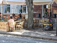 A diesel generator is being used as a backup during power outages near an outdoor cafe in Odesa, Ukraine, on July 23, 2024. NO USE RUSSIA. N...