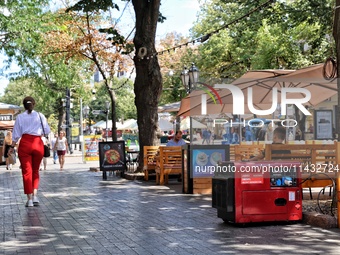 A diesel generator is being used as a backup during power outages by a cafe terrace in Odesa, Ukraine, on July 23, 2024. NO USE RUSSIA. NO U...