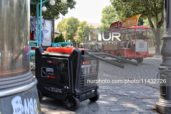 A diesel generator is being used as a backup during power outages in the street in Odesa, Ukraine, on July 23, 2024. NO USE RUSSIA. NO USE B...