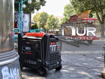 A diesel generator is being used as a backup during power outages in the street in Odesa, Ukraine, on July 23, 2024. NO USE RUSSIA. NO USE B...