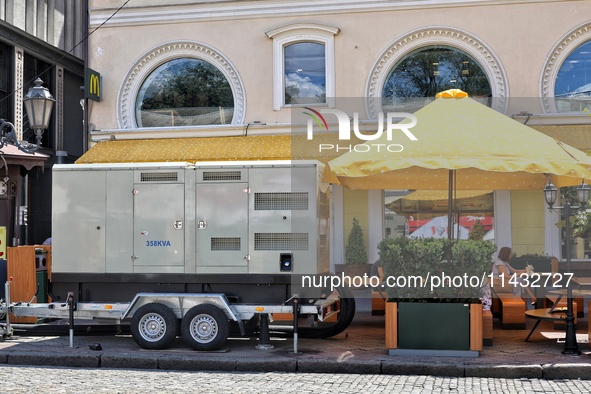 A diesel generator is being used as a backup during power outages in the street in Odesa, Ukraine, on July 23, 2024. NO USE RUSSIA. NO USE B...