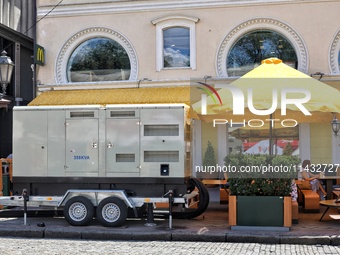 A diesel generator is being used as a backup during power outages in the street in Odesa, Ukraine, on July 23, 2024. NO USE RUSSIA. NO USE B...