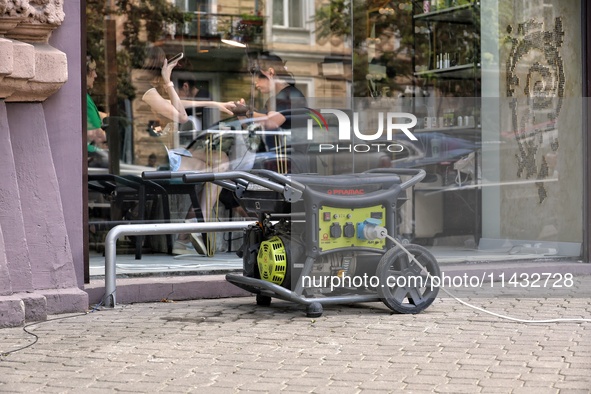 A diesel generator is being used as a backup during power outages outside a beauty salon in Odesa, Ukraine, on July 24, 2024. NO USE RUSSIA....