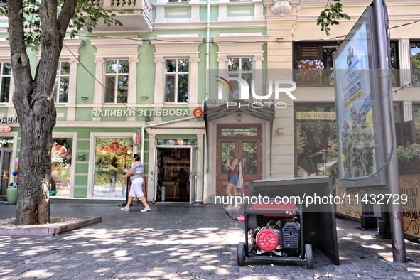 A diesel generator is being used as a backup during power outages in the street in Odesa, Ukraine, on July 23, 2024. NO USE RUSSIA. NO USE B...