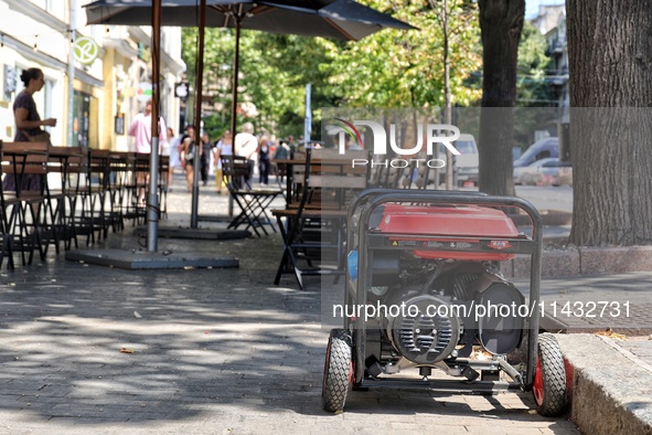 A diesel generator is being used as a backup during power outages in the street in Odesa, Ukraine, on July 23, 2024. NO USE RUSSIA. NO USE B...