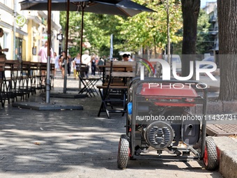 A diesel generator is being used as a backup during power outages in the street in Odesa, Ukraine, on July 23, 2024. NO USE RUSSIA. NO USE B...