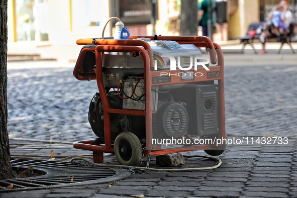 A diesel generator is being used as a backup during power outages in the street in Odesa, Ukraine, on July 23, 2024. NO USE RUSSIA. NO USE B...