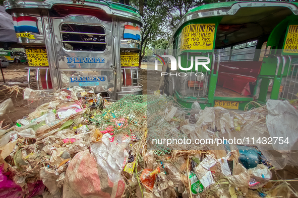 Plastic wastes are being left beside the river in Marikina City, Philippines, on July 25, 2024, after the massive flood in Metro Manila due...