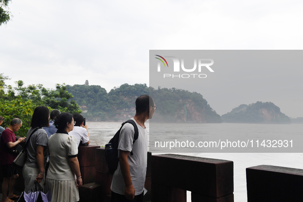 Tourists are visiting the Leshan Giant Buddha scenic spot in Leshan, China, on July 25, 2024. 