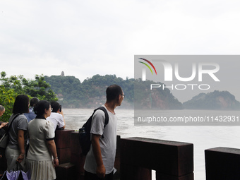 Tourists are visiting the Leshan Giant Buddha scenic spot in Leshan, China, on July 25, 2024. (