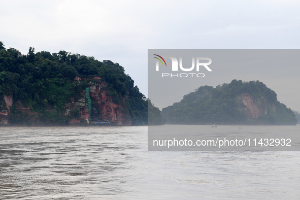 Tourists are visiting the Leshan Giant Buddha scenic spot in Leshan, China, on July 25, 2024. 