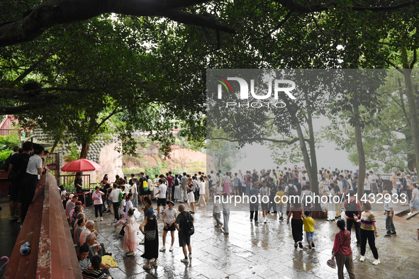 Tourists are visiting the Leshan Giant Buddha scenic spot in Leshan, China, on July 25, 2024. 