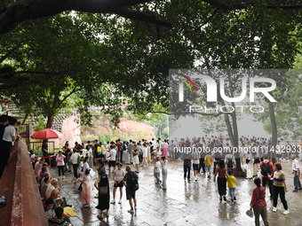 Tourists are visiting the Leshan Giant Buddha scenic spot in Leshan, China, on July 25, 2024. (