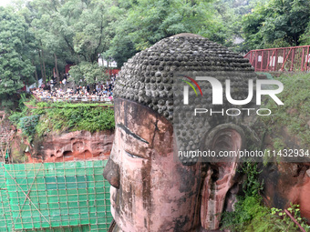 Tourists are visiting the Leshan Giant Buddha scenic spot in Leshan, China, on July 25, 2024. (