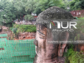 Tourists are visiting the Leshan Giant Buddha scenic spot in Leshan, China, on July 25, 2024. (