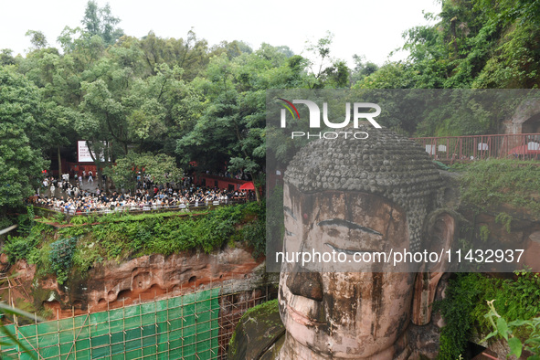 Tourists are visiting the Leshan Giant Buddha scenic spot in Leshan, China, on July 25, 2024. 