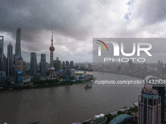 Dark clouds are forming above the Huangpu River in Shanghai, China, on July 25, 2024, as Typhoon Gaemi is heading toward China (