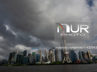 Dark clouds are forming above the Huangpu River in Shanghai, China, on July 25, 2024, as Typhoon Gaemi is heading toward China (