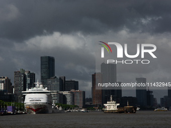 Dark clouds are forming above the Huangpu River in Shanghai, China, on July 25, 2024, as Typhoon Gaemi is heading toward China (