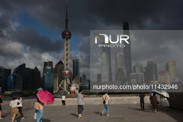 Dark clouds are forming above the Huangpu River in Shanghai, China, on July 25, 2024, as Typhoon Gaemi is heading toward China 