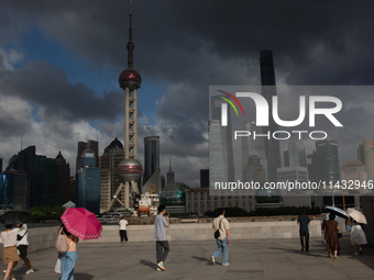 Dark clouds are forming above the Huangpu River in Shanghai, China, on July 25, 2024, as Typhoon Gaemi is heading toward China (