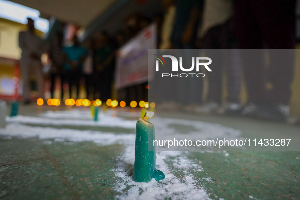 Nepali students affiliated with the Nepal Student Union, the student wing of the Nepali Congress, are holding a candlelight vigil in memory...